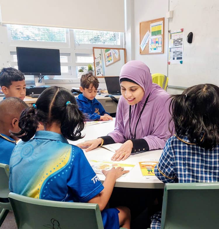 image of support teacher with students